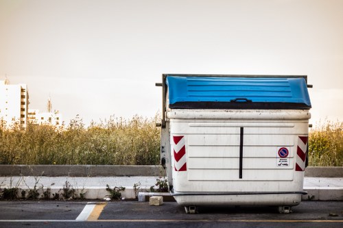 Workers segregating waste during a commercial rubbish collection